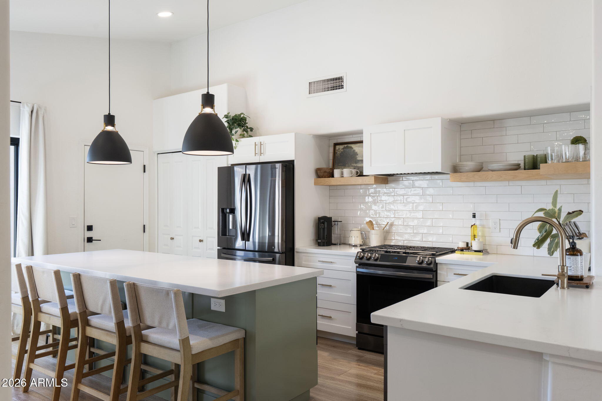 Kitchen after, clean counters, refined styling, professional composition