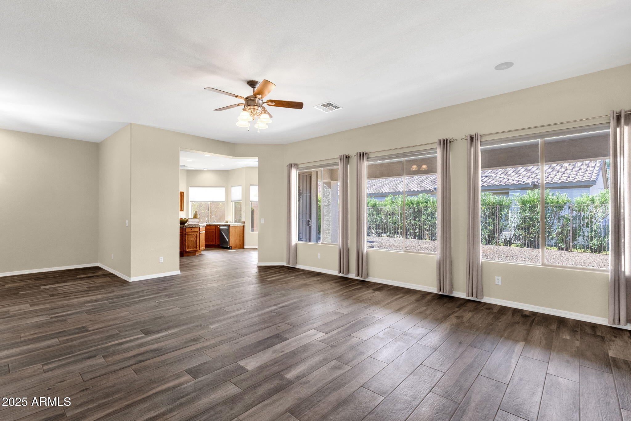 Living room before, empty and flat lighting, listed by previous agent
